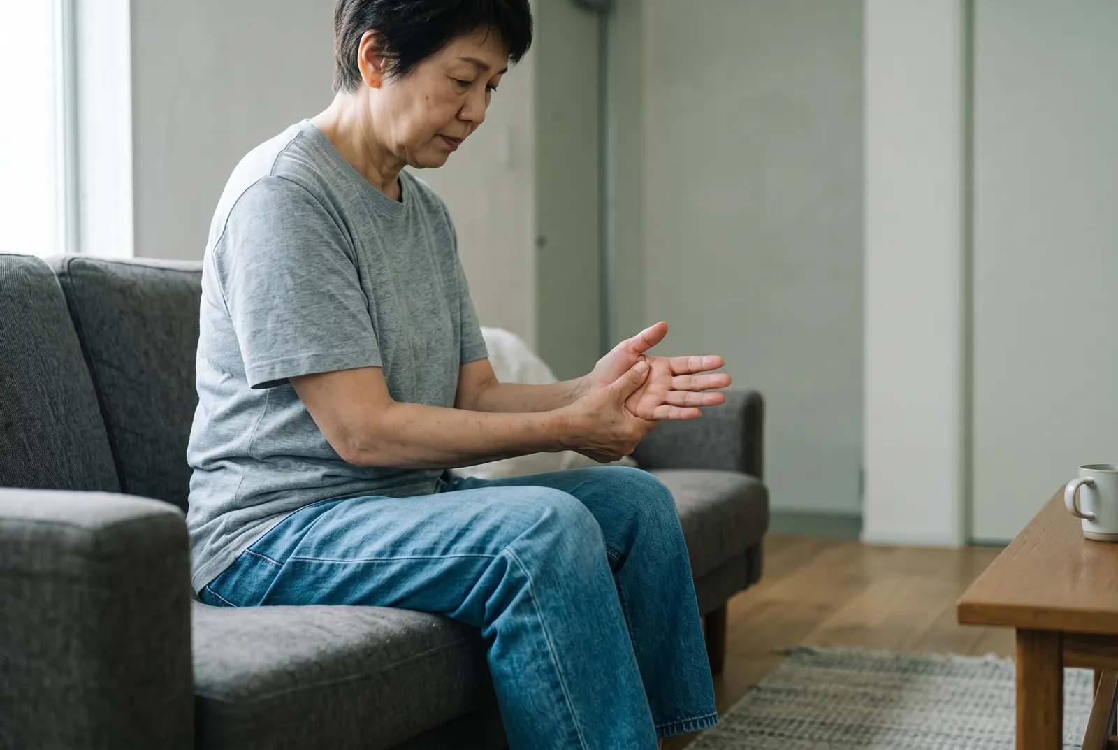 A man stretching his hand and fingers to relieve carpal tunnel symptoms